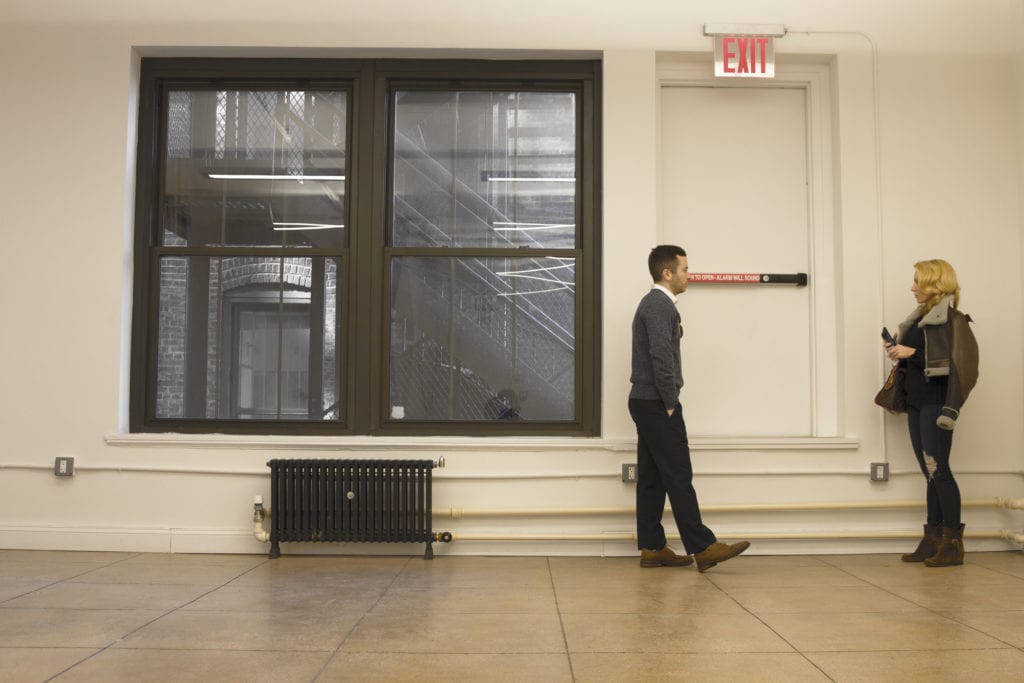 photo; commercial tenant broker showing a space