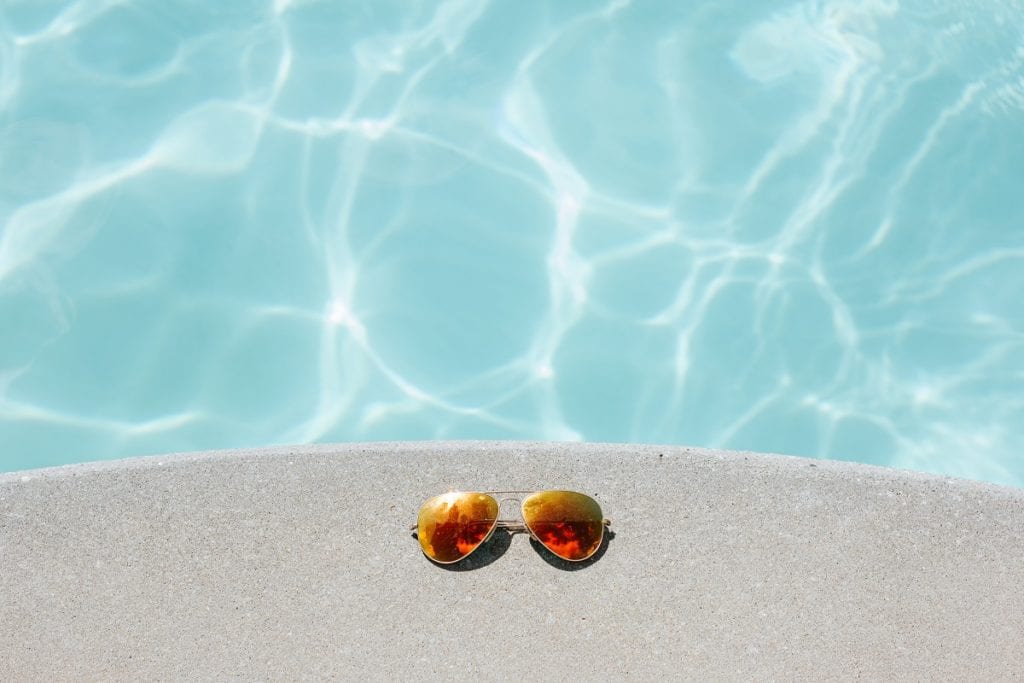 photo; paid time off at the pool, with sunglasses