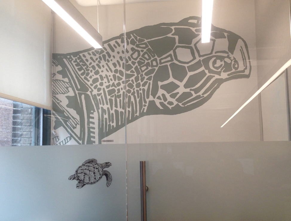 Sea turtle wall art at Cockroach Labs office