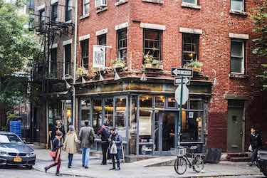 Pedestrians outside of Back Forty West on Prince St., Soho
