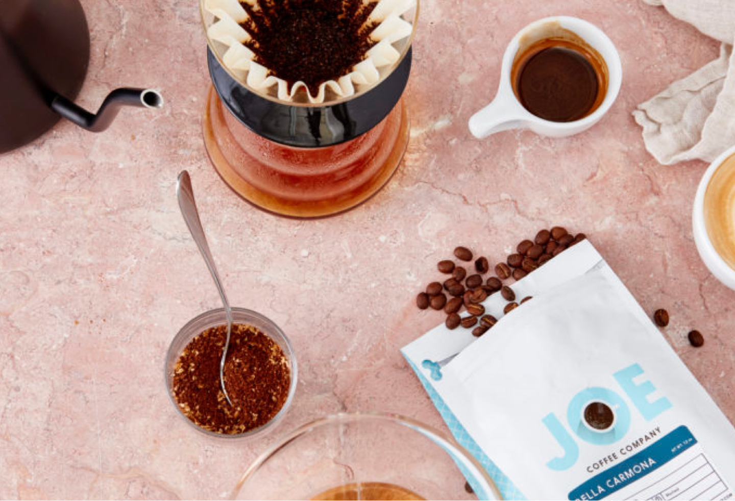 Coffee filter with Joe Coffee beans and grounds