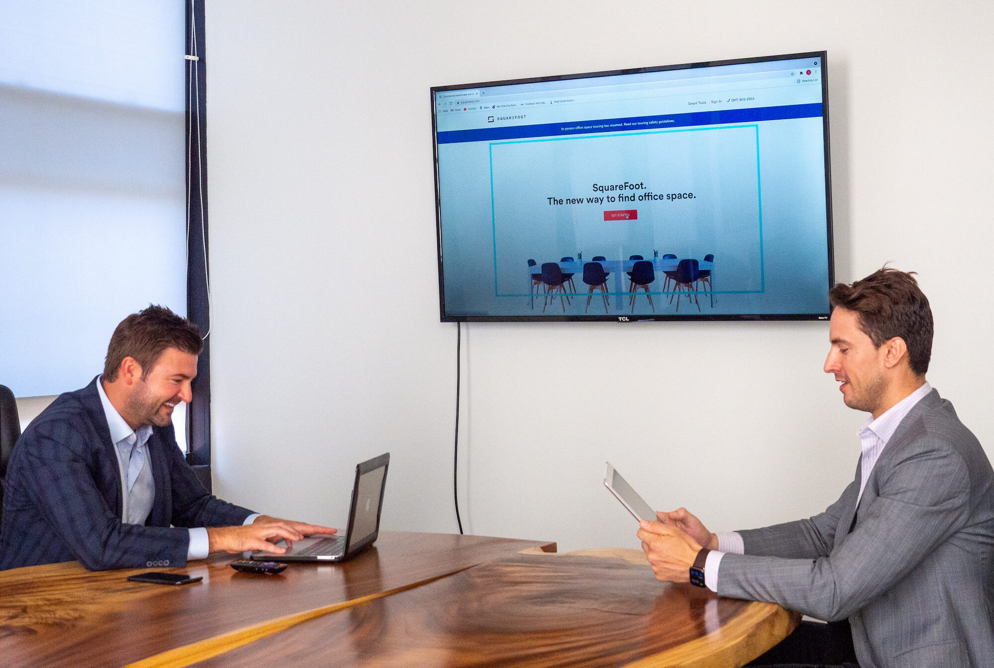 SquareFoot brokers Jonathan Tootell and Chris Hagerup working around a conference table