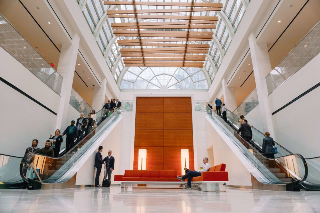 Lobby area with two escalators and a lounge space